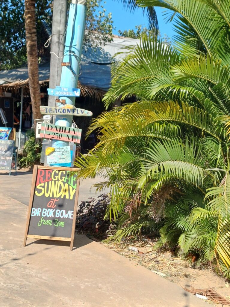 Evening entertainment, advertised on M'Pai Bays's sleepy main street...