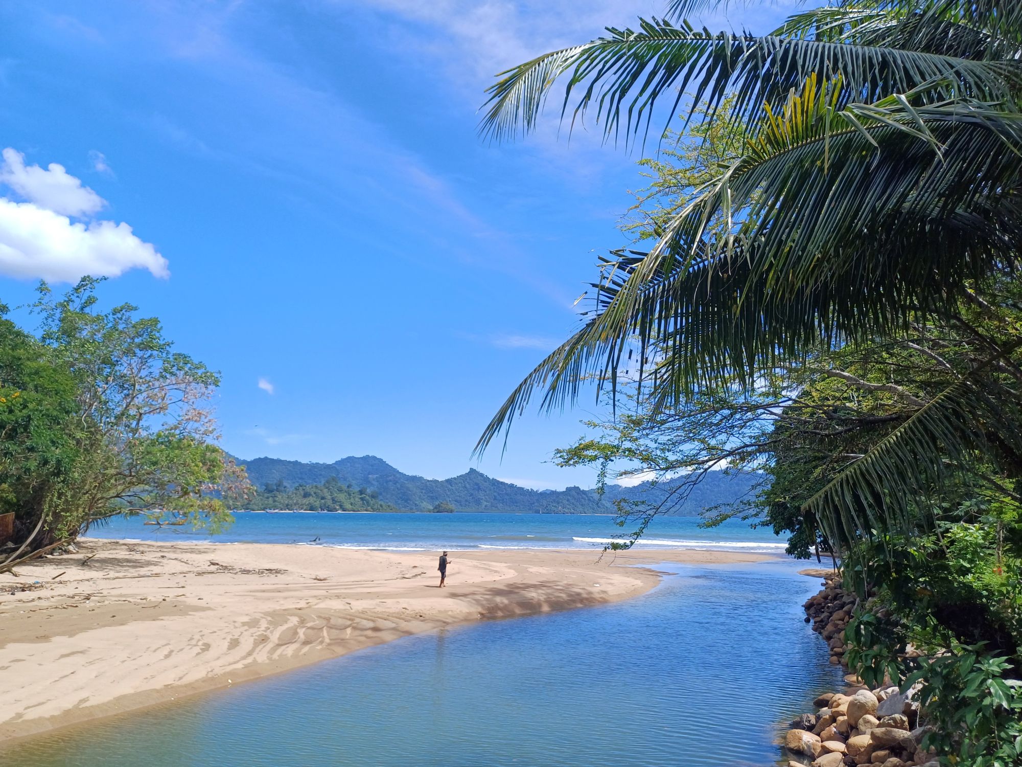 The river meets the sea at Pantai Carolina
