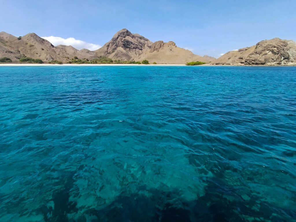 The luminous blue waters of Pink Beach, Padar Island, Komodo National Park.