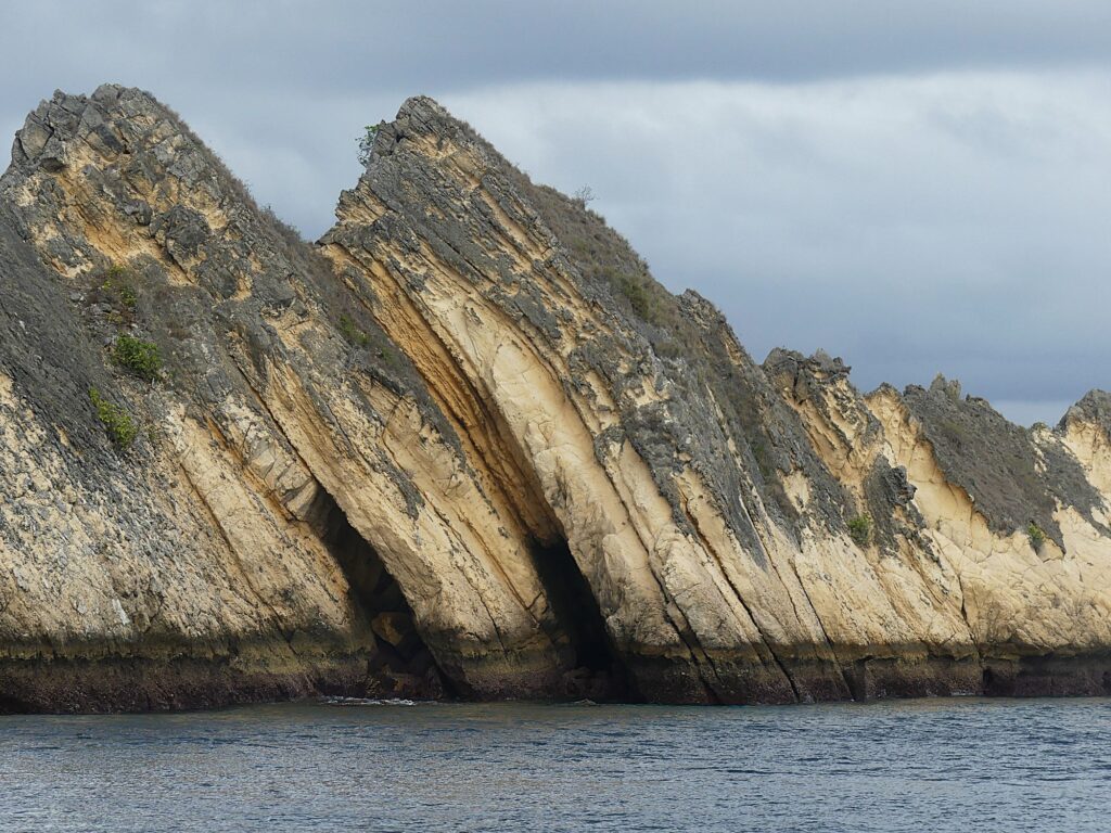 Rugged rock formations on the western side of Padar Island